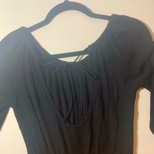 Black long sleeve romper.